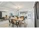 Open-concept dining room connecting to a modern kitchen with updated countertops and appliances at 285 Lakemoore Ne Dr # A, Atlanta, GA 30342