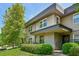 Two-story home with a manicured lawn, a wreath on the front door, and greenery around at 285 Lakemoore Ne Dr # A, Atlanta, GA 30342