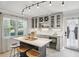 Charming kitchen island with bar seating, stainless fridge, pendant lights, and lots of cabinetry at 285 Lakemoore Ne Dr # A, Atlanta, GA 30342