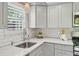 Updated kitchen with white subway tile backsplash and lots of cabinet space at 285 Lakemoore Ne Dr # A, Atlanta, GA 30342