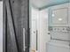 Cozy laundry space features a sliding barn door and stacked washer and dryer at 285 Lakemoore Ne Dr # A, Atlanta, GA 30342