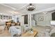 Inviting living room with a dining area, barn door, modern light fixtures and light hardwood floors at 285 Lakemoore Ne Dr # A, Atlanta, GA 30342