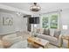 Bright living room featuring a comfortable sofa, stylish decor, and sunlit windows at 285 Lakemoore Ne Dr # A, Atlanta, GA 30342
