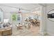 Bright open-concept living room that is connected to the dining area, with modern fixtures and neutral paint at 285 Lakemoore Ne Dr # A, Atlanta, GA 30342