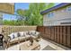 Relaxing patio with a comfortable sectional, wooden fence, and a stylish outdoor rug at 285 Lakemoore Ne Dr # A, Atlanta, GA 30342