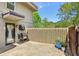 Private outdoor patio space with concrete block wall, stone floor, and grill at 285 Lakemoore Ne Dr # A, Atlanta, GA 30342