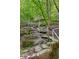 Walking trail through a rocky terrain with a supportive handrail at 285 Lakemoore Ne Dr # A, Atlanta, GA 30342