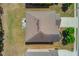 Aerial view of the home featuring a well-maintained roof, large yard, and a driveway at 3049 Ivy Crossing Dr, Buford, GA 30519