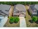 Aerial view of a beautiful two-story home with a well-kept lawn and a two-car garage at 3049 Ivy Crossing Dr, Buford, GA 30519
