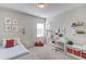 Playful bedroom with a blue bed, study desk, ample storage, and carpet at 3049 Ivy Crossing Dr, Buford, GA 30519