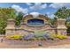 Community entrance sign for The Village at Ivy Creek with colorful flowerbeds at 3049 Ivy Crossing Dr, Buford, GA 30519