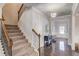Inviting foyer with hardwood floors, staircase, and plenty of room to greet your guests at 3049 Ivy Crossing Dr, Buford, GA 30519