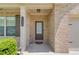 Close-up of front door with brick facade and decorative house number at 3049 Ivy Crossing Dr, Buford, GA 30519