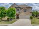 Charming two-story home with a well-manicured lawn and a two-car garage at 3049 Ivy Crossing Dr, Buford, GA 30519