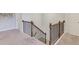 Upstairs landing with wood and iron railings, carpet and doors to the bedrooms at 3049 Ivy Crossing Dr, Buford, GA 30519