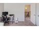 This home office offers natural light, plush carpet, and close access to the landing and bedrooms at 3049 Ivy Crossing Dr, Buford, GA 30519
