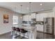 Gourmet kitchen with an island, granite countertops and stainless steel appliances at 3049 Ivy Crossing Dr, Buford, GA 30519