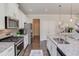 Modern kitchen with granite countertops, stainless steel appliances and lots of room for cooking at 3049 Ivy Crossing Dr, Buford, GA 30519