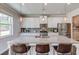 Kitchen featuring a large island with seating, stainless appliances, and granite countertops at 3049 Ivy Crossing Dr, Buford, GA 30519