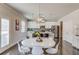 Eat-in kitchen featuring a white table with seating and a stainless-steel refrigerator at 3049 Ivy Crossing Dr, Buford, GA 30519