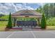 Community mailboxes under a stylish pavilion, flanked by decorative trees, ensuring convenient mail access at 3049 Ivy Crossing Dr, Buford, GA 30519
