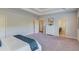 Large main bedroom with neutral colors, carpet, and a large dresser with a mirror at 3049 Ivy Crossing Dr, Buford, GA 30519