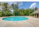 Large community pool with a zero entry side and a round umbrella table for Gathering fun, surrounded by landscaping at 3049 Ivy Crossing Dr, Buford, GA 30519