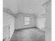 Empty walk-in closet featuring wire shelving and a window for natural light at 4890 Revere Way, Cumming, GA 30028