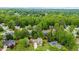 Aerial view of a neighborhood with lush greenery showcasing a home's location and surrounding landscape at 230 Bristolstone Ct, Alpharetta, GA 30005
