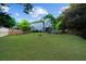Large backyard with mature trees, lawn, and screened-in porch at 230 Bristolstone Ct, Alpharetta, GA 30005