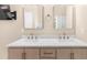 This bathroom features double sinks, marble countertop, and updated cabinet at 230 Bristolstone Ct, Alpharetta, GA 30005