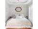Cozy bedroom features neutral paint, white linen bedding, tray ceilings, recessed lighting, and modern style at 230 Bristolstone Ct, Alpharetta, GA 30005