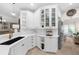 Kitchen featuring white cabinetry, white countertops, stainless steel appliances, and a black sink at 230 Bristolstone Ct, Alpharetta, GA 30005