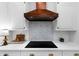 The kitchen features white countertops, stainless steel appliances, and a wooden range hood at 230 Bristolstone Ct, Alpharetta, GA 30005