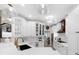 Gourmet kitchen with quartz countertops, white cabinetry, glass cabinet doors and stainless steel appliances at 230 Bristolstone Ct, Alpharetta, GA 30005