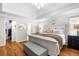 The main bedroom includes hardwood floors, walk-in closet and ensuite bathroom at 230 Bristolstone Ct, Alpharetta, GA 30005
