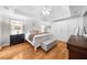 The main bedroom includes hardwood floors, and a tray ceiling at 230 Bristolstone Ct, Alpharetta, GA 30005