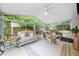 Well-lit sunroom with vaulted ceiling, and casual seating at 230 Bristolstone Ct, Alpharetta, GA 30005