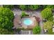 Aerial view of the community pool, surrounded by lush landscaping and ample parking at 2700 Pine Tree Ne Rd # 1214, Atlanta, GA 30324