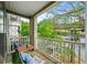 Relaxing outdoor balcony area with seating and a view of the lush green trees at 2700 Pine Tree Ne Rd # 1214, Atlanta, GA 30324
