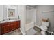 Bathroom with granite countertop vanity, wood cabinets, tile floors, and shower with bathtub at 2700 Pine Tree Ne Rd # 1214, Atlanta, GA 30324