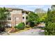 Exterior view of a brick apartment building with well-maintained landscaping and a paved parking area in front at 2700 Pine Tree Ne Rd # 1214, Atlanta, GA 30324