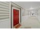 Well-lit hallway featuring a red door and neutral decor, creating a welcoming entrance at 2700 Pine Tree Ne Rd # 1214, Atlanta, GA 30324