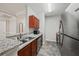 Galley kitchen showcasing granite countertops, stainless steel appliances, and hardwood cabinetry at 2700 Pine Tree Ne Rd # 1214, Atlanta, GA 30324
