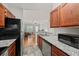 Kitchen featuring granite countertops, stainless steel appliances, and hardwood cabinets at 2700 Pine Tree Ne Rd # 1214, Atlanta, GA 30324