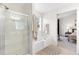Bright bathroom featuring tiled floors, a glass enclosed shower and access to the main bedroom at 3303 Timbercreek Cir, Roswell, GA 30076