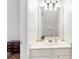 Bathroom vanity featuring a neutral countertop, white cabinets, and a large mirror at 3303 Timbercreek Cir, Roswell, GA 30076