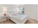 Cozy bedroom with a white bed, mirrored nightstands, and a window at 3303 Timbercreek Cir, Roswell, GA 30076
