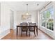 Formal dining area with modern chandelier, large windows offering great natural light at 3303 Timbercreek Cir, Roswell, GA 30076
