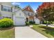 Charming townhome featuring a red brick accent, a single-car garage, and well-maintained landscaping at 3303 Timbercreek Cir, Roswell, GA 30076